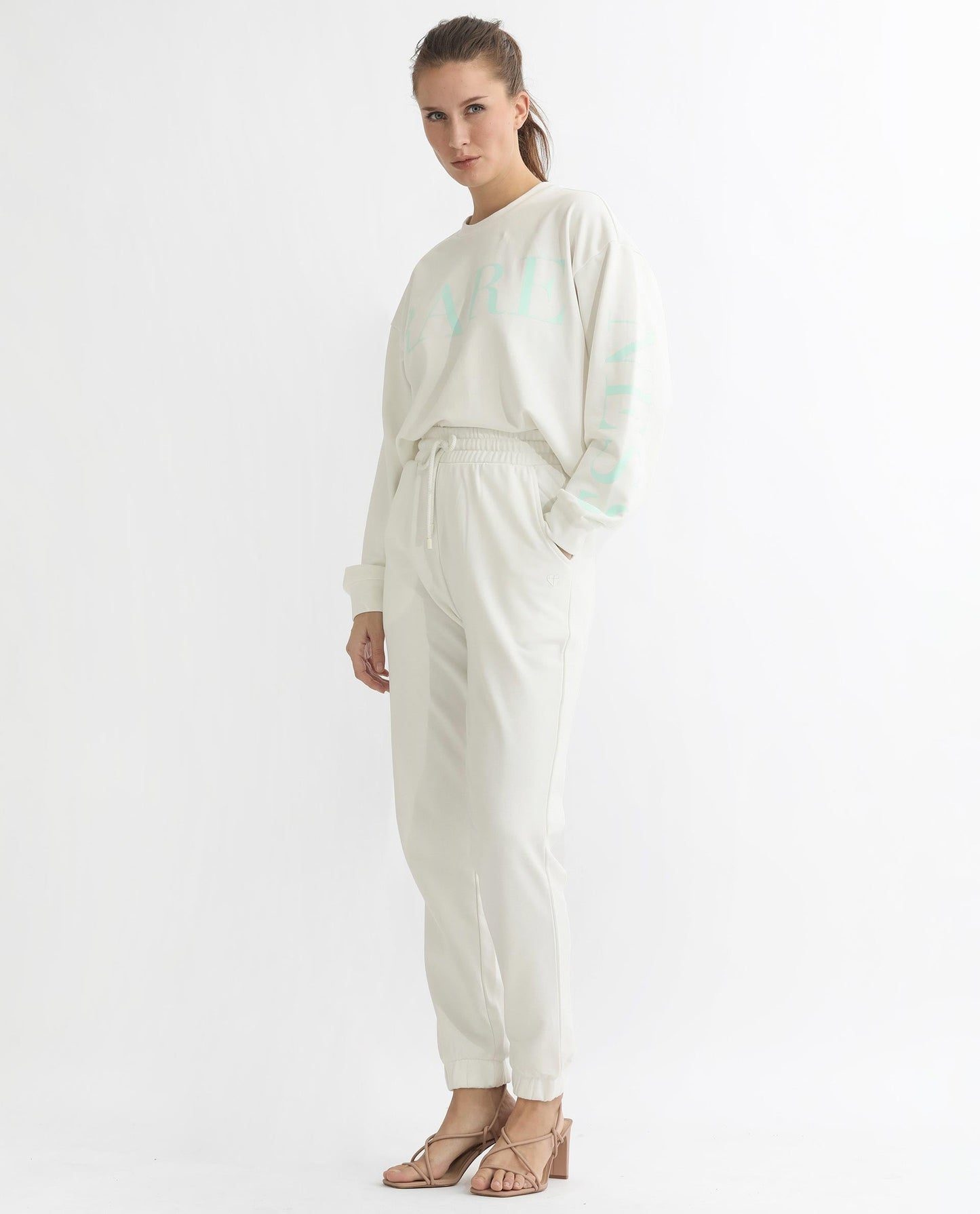 Rareism Articale Women Terac T Off White Poly Cotton Fabric Drawstring Closure Regular Fit Plain Ankle Length Track Pant